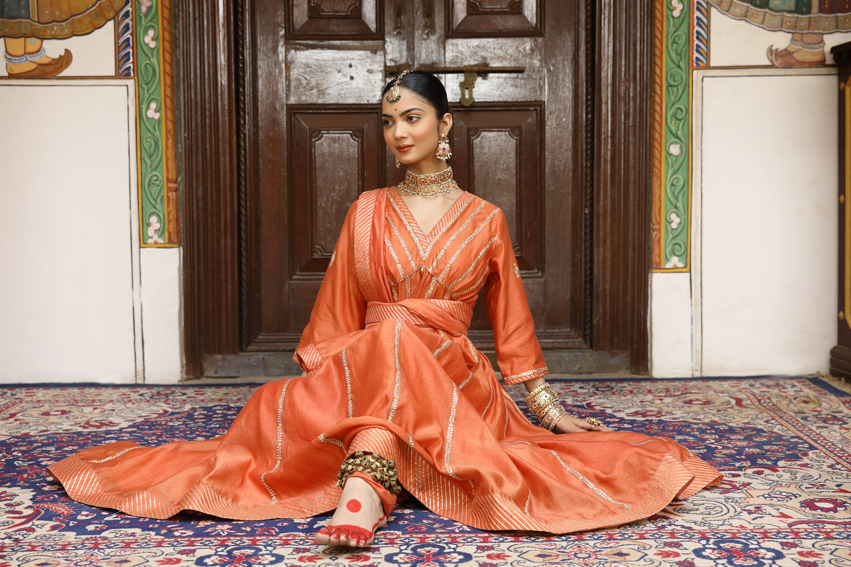 Rust Anarkali Set with Pittan, Gota, and Tassel Detailing