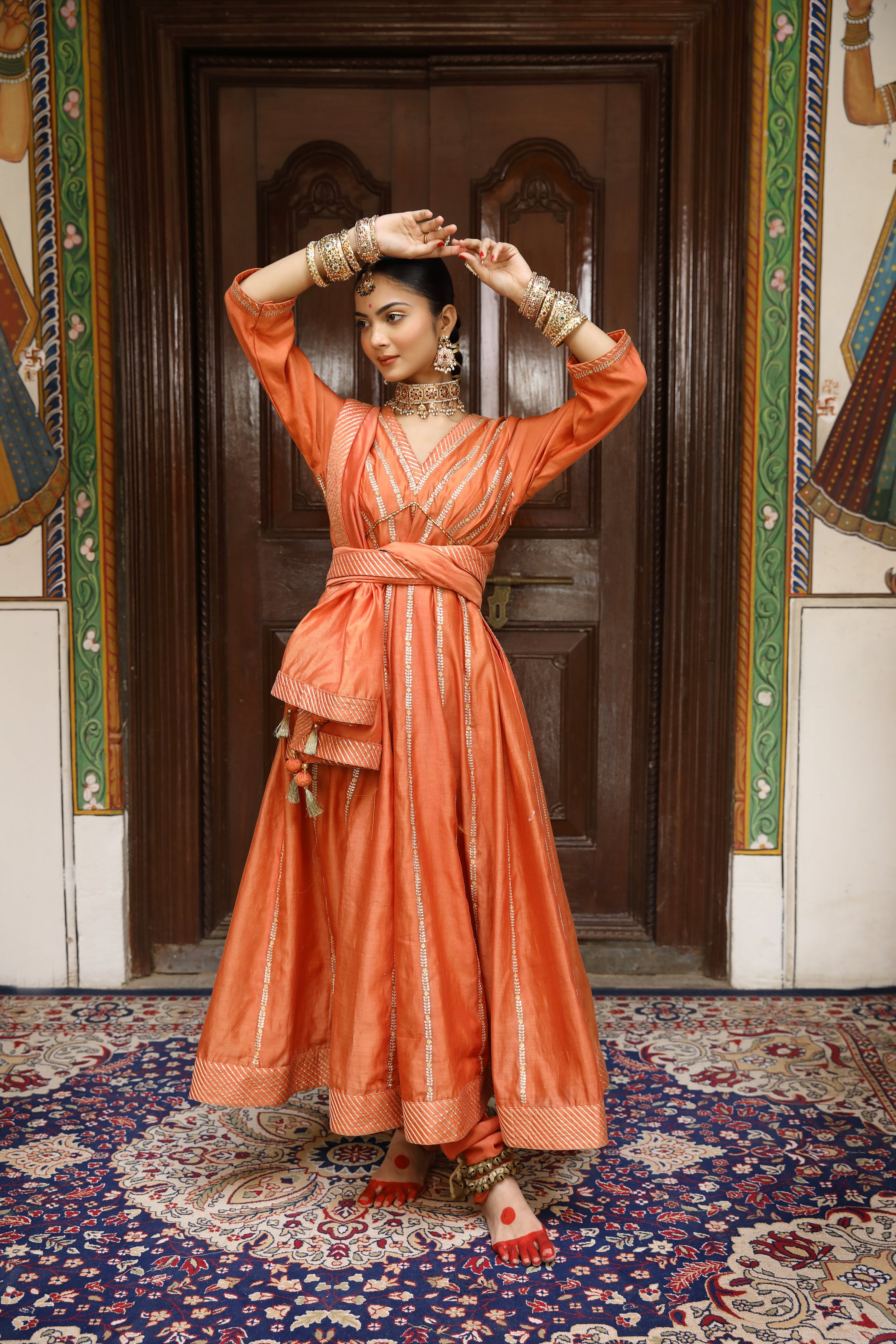 Rust Anarkali Set with Pittan, Gota, and Tassel Detailing