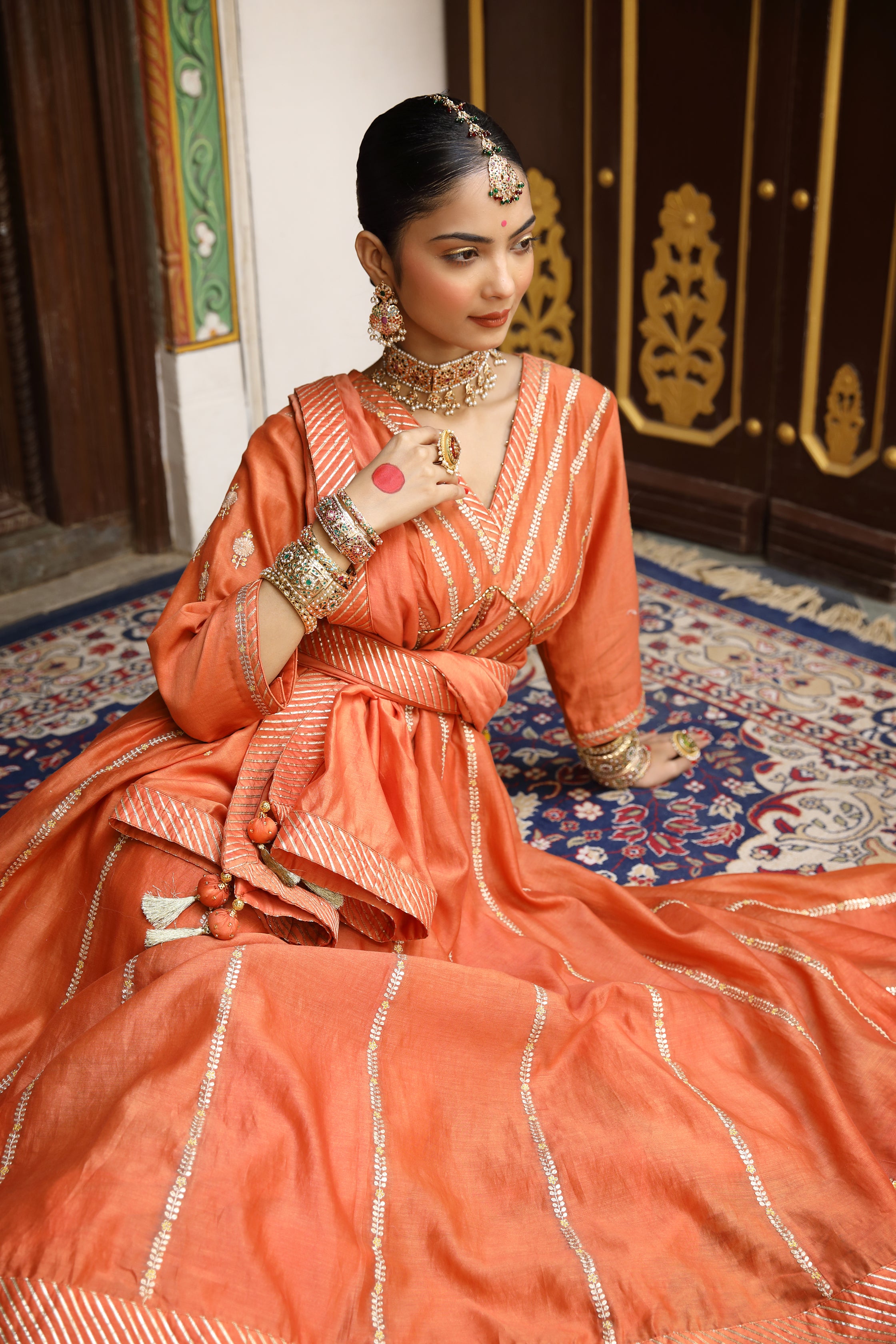 Rust Anarkali Set with Pittan, Gota, and Tassel Detailing